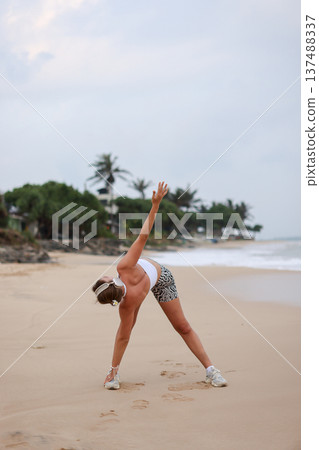 Female Performing Mobility Exercise Outdoors. Woman Engaged In Balance And Strength Training Outdoors Female Performing Mobility Exercise Outdoors. Woman Engaged In Balance And Strength Training Outdoors 137488337
