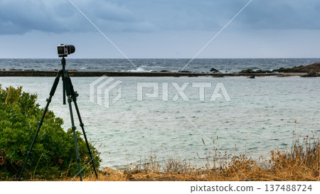 Camera taking picture film of sea coast Camera taking picture film of sea coast 137488724