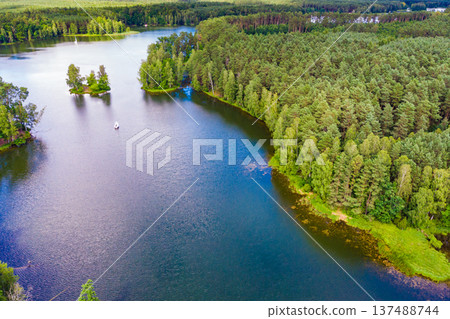 Aerial view yacht on lake in Tuchola Forests, Poland. Aerial view yacht on lake in Tuchola Forests, Poland. 137488744