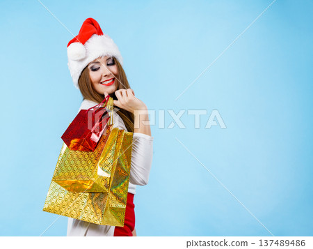 Happy Christmas woman with paper gift bags Happy Christmas woman with paper gift bags 137489486