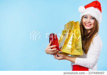 Happy Christmas woman with paper gift bags Happy Christmas woman with paper gift bags 137489487