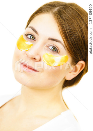 Woman with gold patches under eyes 137489490