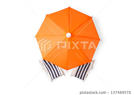 Orange umbrella stands above two striped beach chairs, PNG 137489578