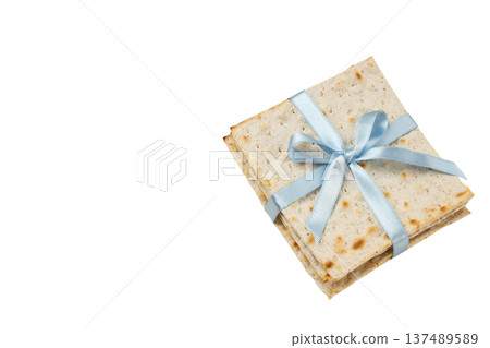 Matzah is wrapped in blue ribbon for Passover, isolated, PNG Matzah is wrapped in blue ribbon for Passover, isolated, PNG 137489589