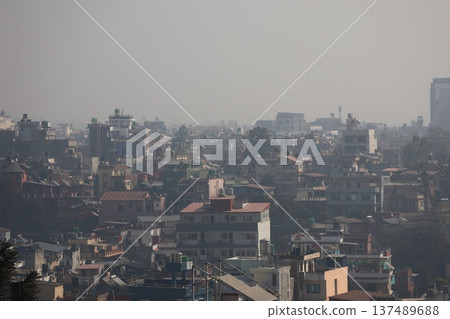 A cityscape of the city of Kathmandu, Nepal with a hazy sky and buildings A cityscape of the city of Kathmandu, Nepal with a hazy sky and buildings 137489688