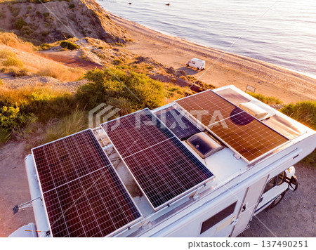 Caravan with solar panels on roof camp on coast, Spain. Aerial view. Caravan with solar panels on roof camp on coast, Spain. Aerial view. 137490251