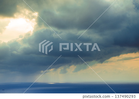 Evening sky with dark stormy clouds. 137490293