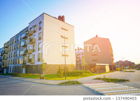 Modern apartment building residential complex in sunny environment. Apartment complex uk.  137490403