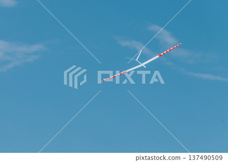 RC soaring plane on blue sky 137490509