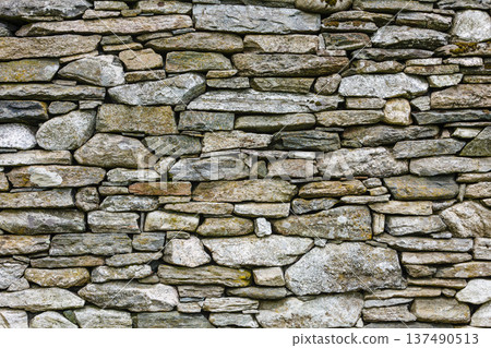 Background wall made of grey stone rocks Background wall made of grey stone rocks 137490513