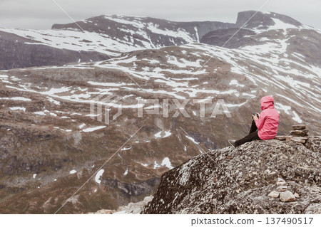 Tourist woman on Dalsnibba viewpoint Norway Tourist woman on Dalsnibba viewpoint Norway 137490517