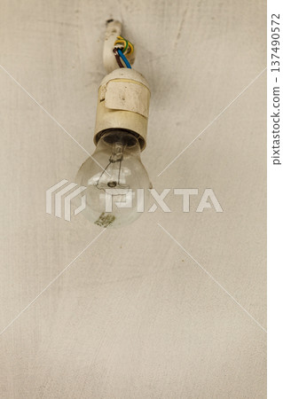 Small bulb hanging on bare wires, Small bulb hanging on bare wires, 137490572