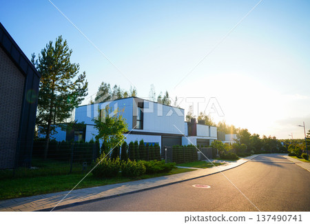Houses in exclusive upmarket private housing estate. Luxurious villa. Street with modern House Houses in exclusive upmarket private housing estate. Luxurious villa. Street with modern House 137490741