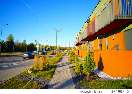 Walkway at Townhome in Greenery Neighborhood. Landscaping for modern residential buildings.  137490750