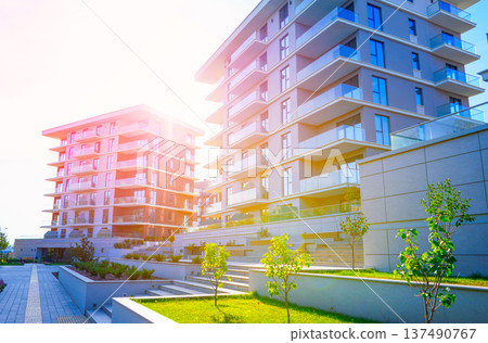 New modern block of flats, residential apartments. Flat buildings house. Apartments hotel complex. New modern block of flats, residential apartments. Flat buildings house. Apartments hotel complex. 137490767