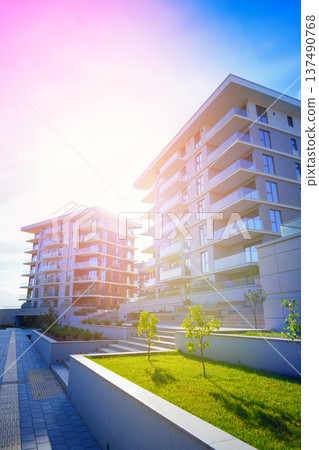 New modern block of flats, residential apartments. Flat buildings house. Apartments hotel complex. New modern block of flats, residential apartments. Flat buildings house. Apartments hotel complex. 137490768