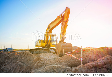 Excavator earthworks on construction site. Sewer line repair. Excavator groundwork water line repair 137490786