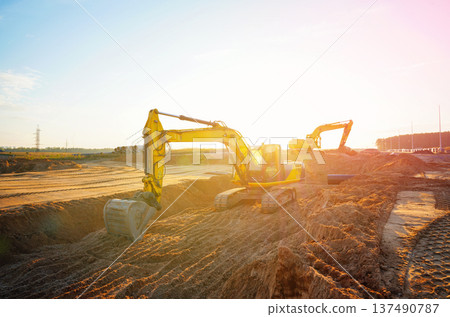 Excavator earthworks on construction site. Sewer line repair. Excavator groundwork water line repair Excavator earthworks on construction site. Sewer line repair. Excavator groundwork water line repair 137490787