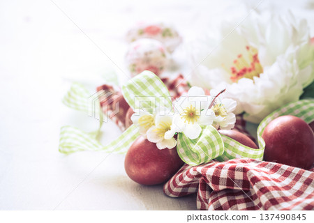 Easter background with a basket and red eggs with flowers Easter background with a basket and red eggs with flowers 137490845