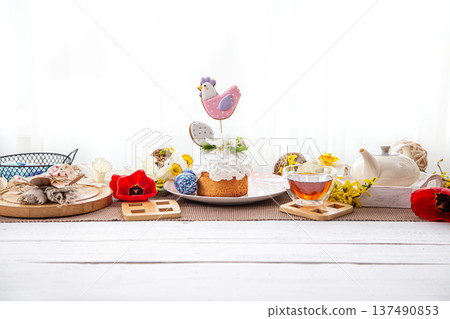 Festive Easter cake on the table among flowers and other details copy space. 137490853