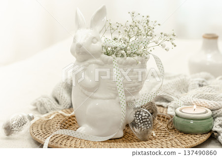 Easter composition with a ceramic hare and gypsophila flowers. Easter composition with a ceramic hare and gypsophila flowers. 137490860