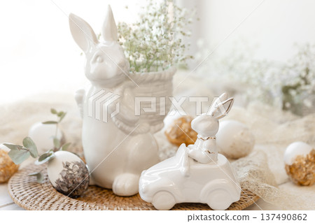 Easter composition with a ceramic hare and gypsophila flowers. Easter composition with a ceramic hare and gypsophila flowers. 137490862