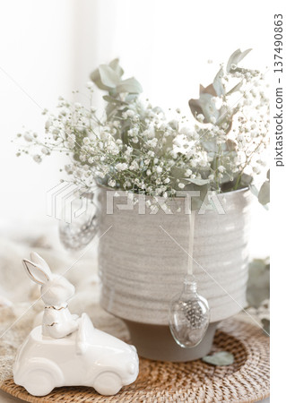 Easter composition with a ceramic hare and gypsophila flowers. Easter composition with a ceramic hare and gypsophila flowers. 137490863