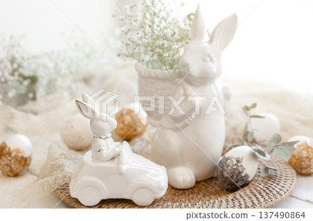 Easter composition with a ceramic hare and gypsophila flowers. 137490864