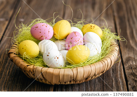Easter composition with eggs in a decorative nest. 137490881