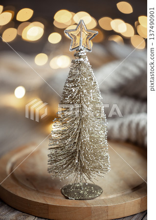 Decorative Christmas tree on blurred background with bokeh. Decorative Christmas tree on blurred background with bokeh. 137490901