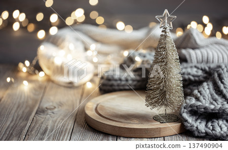 Decorative Christmas tree on blurred background with bokeh. 137490904
