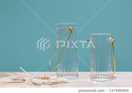 Decorative glass jars for storage on a blue background. 137490905