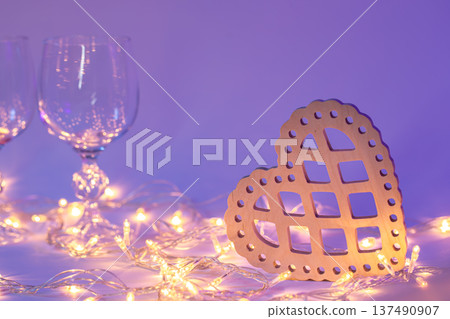 Decorative heart tree and garland in neon lighting, Valentine's Day background. Decorative heart tree and garland in neon lighting, Valentine's Day background. 137490907