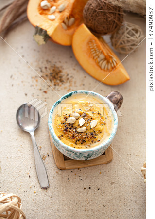 Appetizing composition with pumpkin soup top view. 137490937