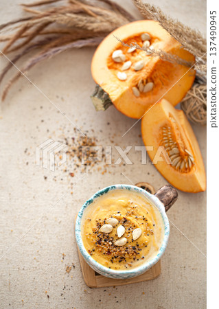 Appetizing composition with pumpkin soup top view. 137490945