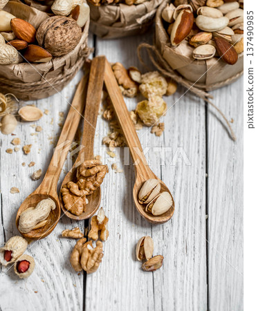 different nuts in plates 137490985