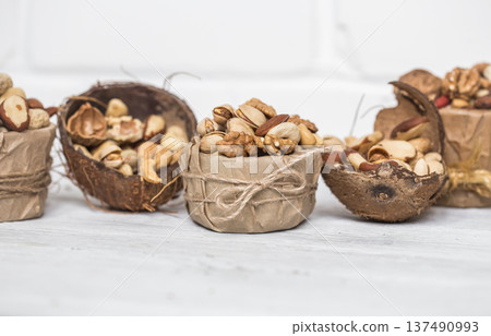 different nuts in a plate closeup 137490993