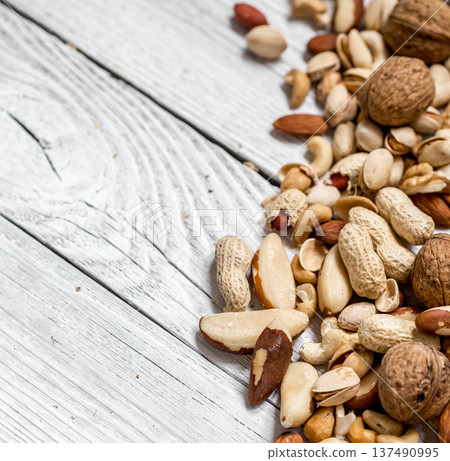 different nuts on white wooden background , different nuts on white wooden background , 137490995