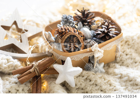 Cozy winter still life, Christmas decorations on cozy blanket. 137491034