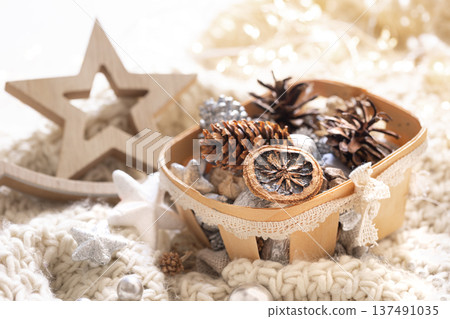 Cozy winter still life, Christmas decorations on cozy blanket. 137491035