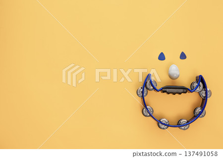 Creative musical background with tambourine, shaker and guitar picks. Creative musical background with tambourine, shaker and guitar picks. 137491058