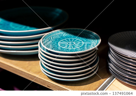Crockery on the showcase of a store of things for the home. Crockery on the showcase of a store of things for the home. 137491064