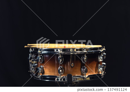Drum close-up. Drumsticks with a drum. Drum close-up. Drumsticks with a drum. 137491124