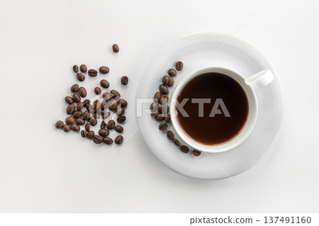 Cup of coffee and coffee beans, flat lay. Cup of coffee and coffee beans, flat lay. 137491160