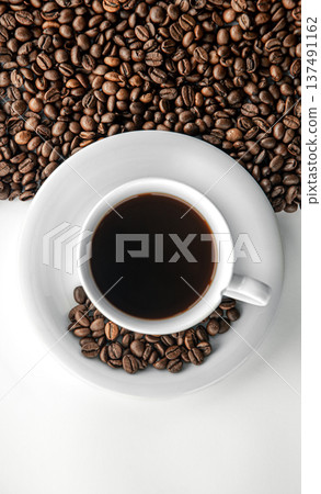 Cup of coffee and coffee beans, flat lay. 137491162