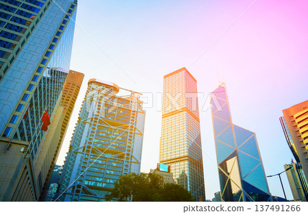 Skyscrapers in bright glass exteriors sunlight on sunset. Modern facade office buildings 137491266