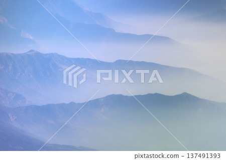 A view of the sea of clouds and mountains from the window of a mountain flight plane 137491393