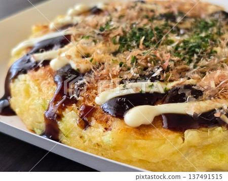 Close-up of reheated frozen okonomiyaki Close-up of reheated frozen okonomiyaki 137491515