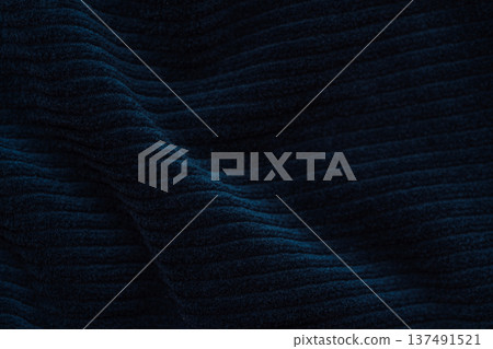 Dark navy ribbed fabric texture with soft folds, minimal textile background Dark navy ribbed fabric texture with soft folds, minimal textile background 137491521