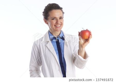 Female Doctor with Apple - Nutrition and Wellness Concept Female Doctor with Apple - Nutrition and Wellness Concept 137491872